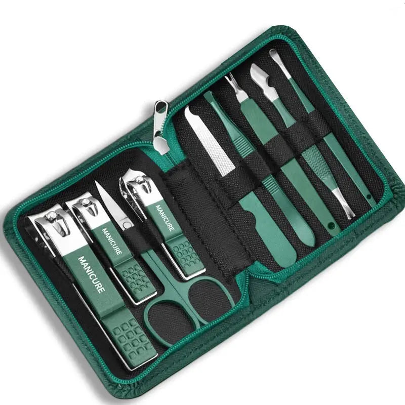 Manicure set with tools in a green case on a white background