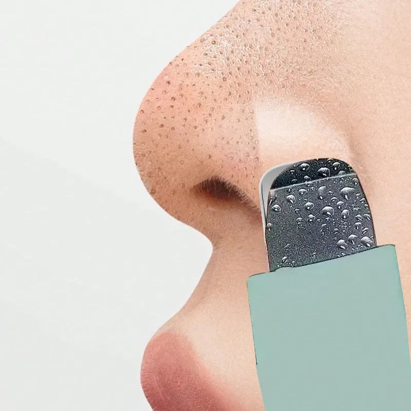 Close-up of a nose with a blackhead removal tool on a white background